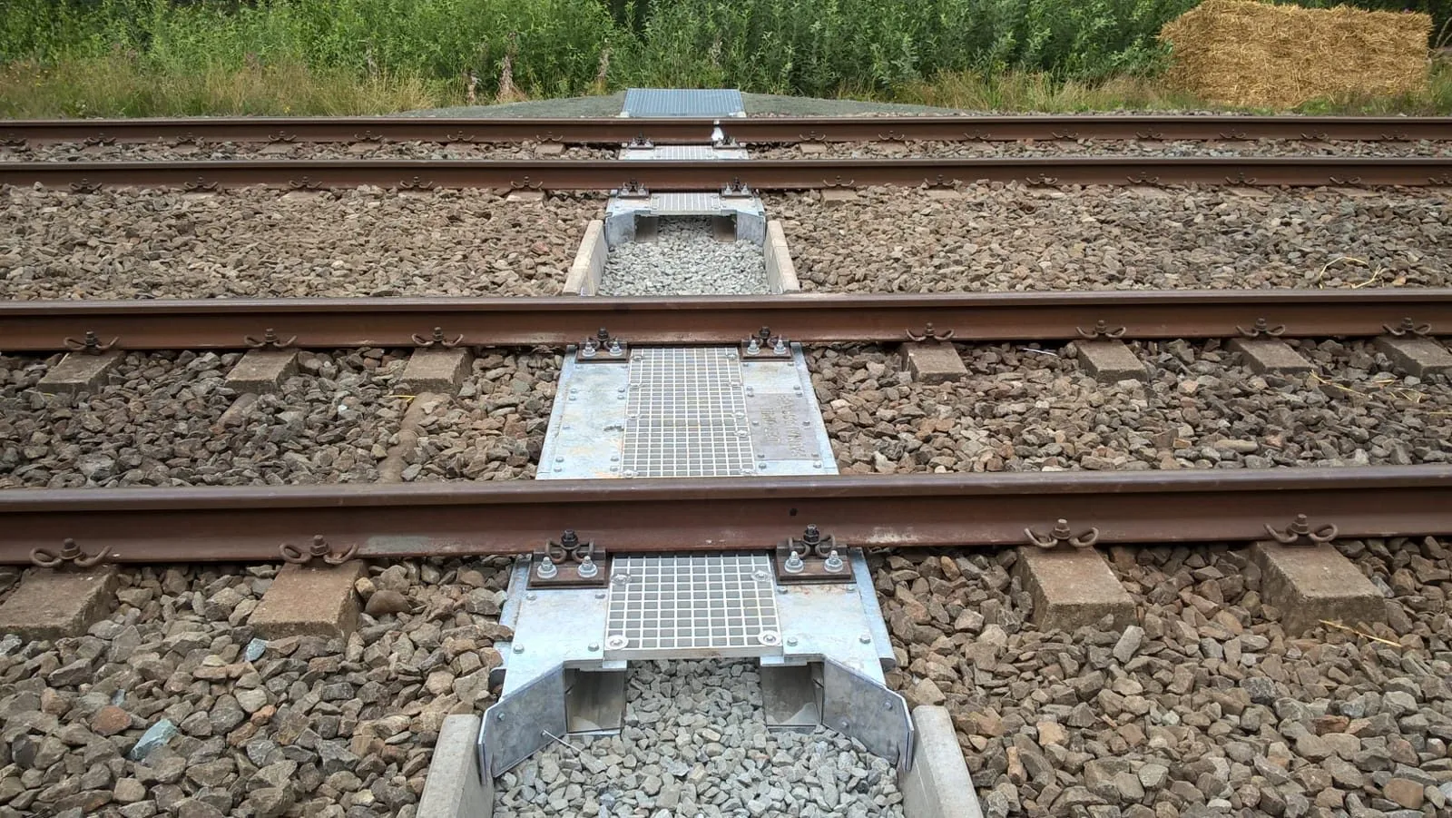 The fauna passage crossing under two tracks, with grating decks between the rails