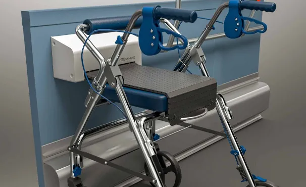A rollator parked and locked into the wall-mounted Rollator-Rest unit